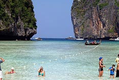 Tour Package Phuket Island with our famous Poda Island sitting on the water.