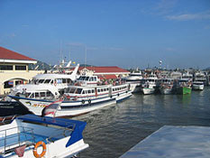 Phi Phi Island Cruiser Tours Big Boat parking at Rassada Pier with other companies' charters